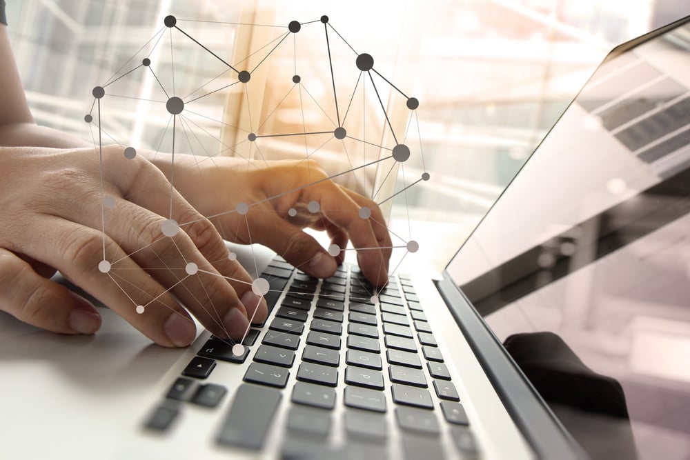 Hands over laptop keyboard with graphic overlay Hands over laptop keyboard with graphic overlay